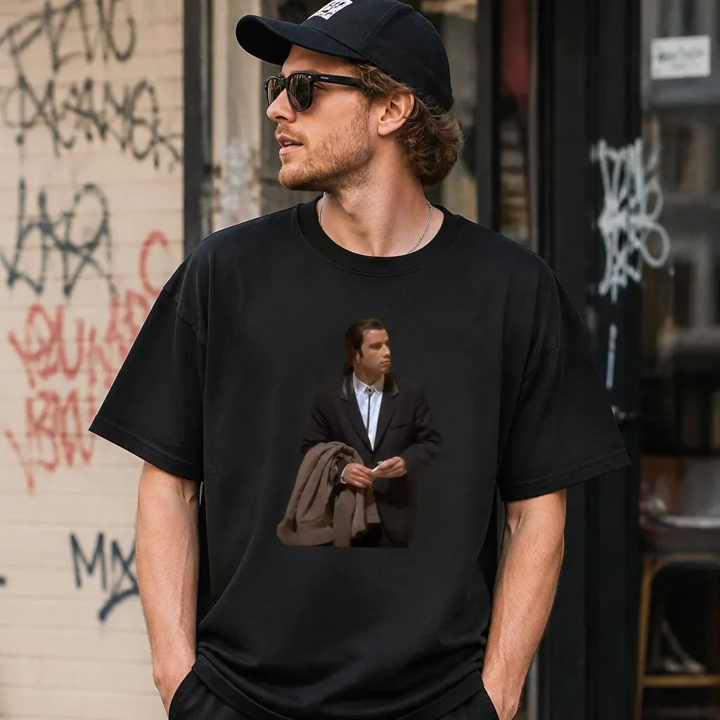 Model wearing John Travolta Looking Around T-Shirt T-Shirts in Black